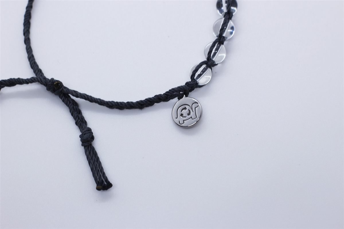 Bracelet detail: knot and charm